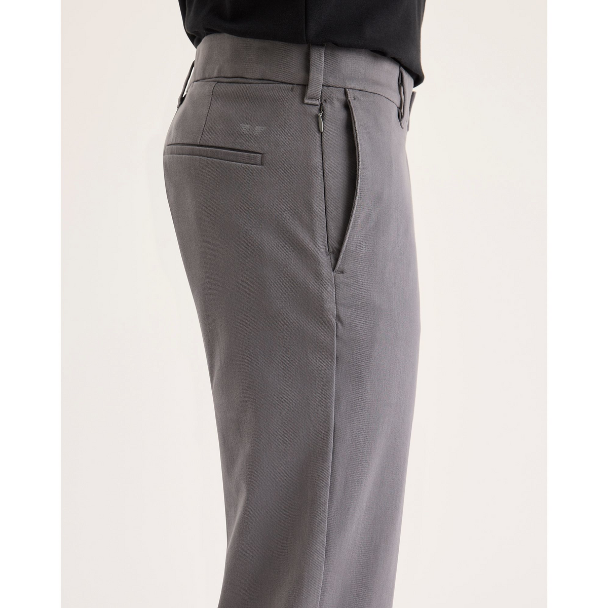 Side view of model wearing Car Park Grey Go Activeflex Chino, Slim Fit.
