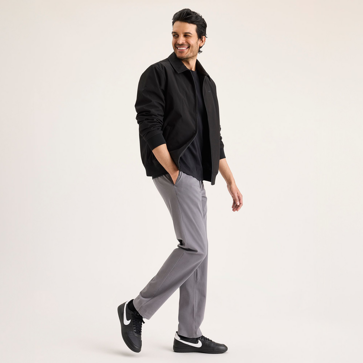 View of model wearing Car Park Grey Go Activeflex Chino, Slim Fit.