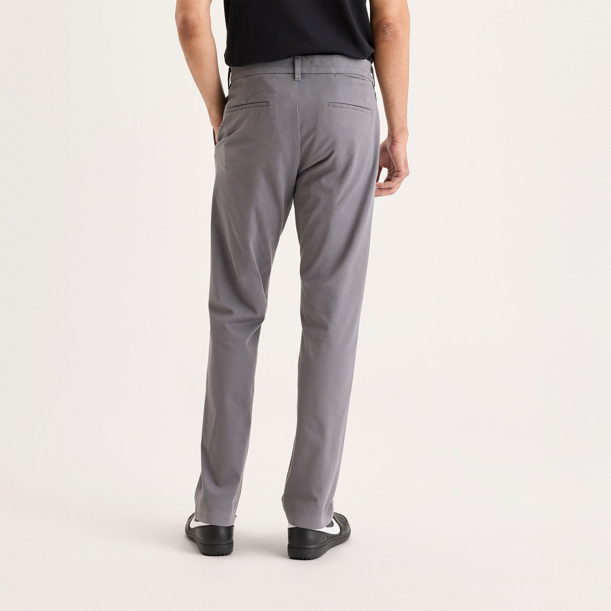 Back view of model wearing Car Park Grey Go Activeflex Chino, Slim Fit.